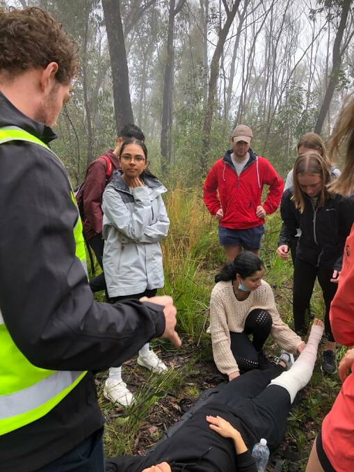 IN THE BUSH: Students learnt how to do a snake bite tourniquet. Picture: SUPPLIED 