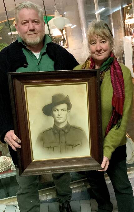 FIND A HOME: Eric and Heather Mahony find a picture of World War I digger. Photo: SUPPLIED 