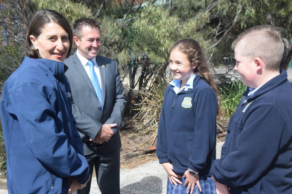 Premier Gladys Berejiklian, MP Paul Toole greet school captains Amy Gordon and Mitchell Wallace. Picture: CIARA BASTOW. 