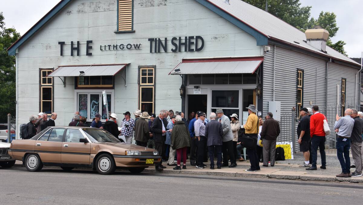 The group waits out the front of the Tin Shed before heading out to the Gardens of Stone. 