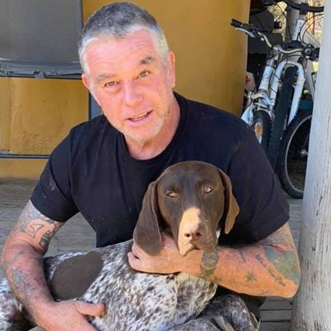 Tim Frew with his best mate after a long day. Picture: SUPPLIED