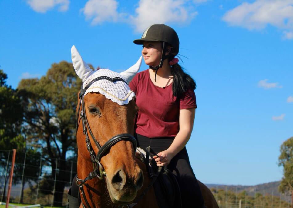 PARTNER: Amber Hayes and her horse Red have a strong partnership which has helped Amber with her mental health disorder. Photo: SUPPLIED 
