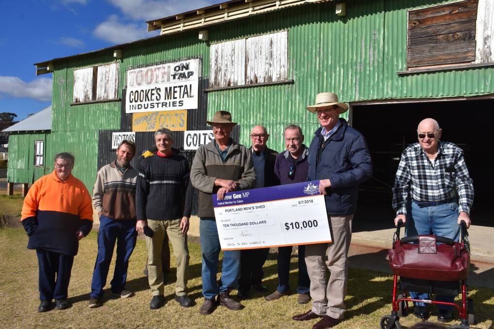 Member for Calare hands over a cheque for $10,000 to the members of the Portland Men's Shed. Pictures: CIARA BASTOW. 