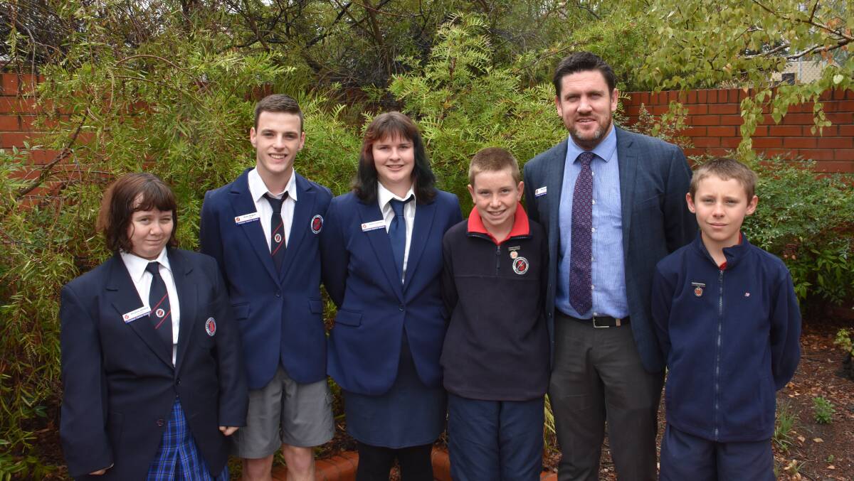 TOGETHER: Secondary captains Rhianna Garland, Noah Nugent and Katie Coleman with primary captains Zachary Wallis and Xavier Parker with principal Matt Quirk. Picture: CIARA BASTOW 