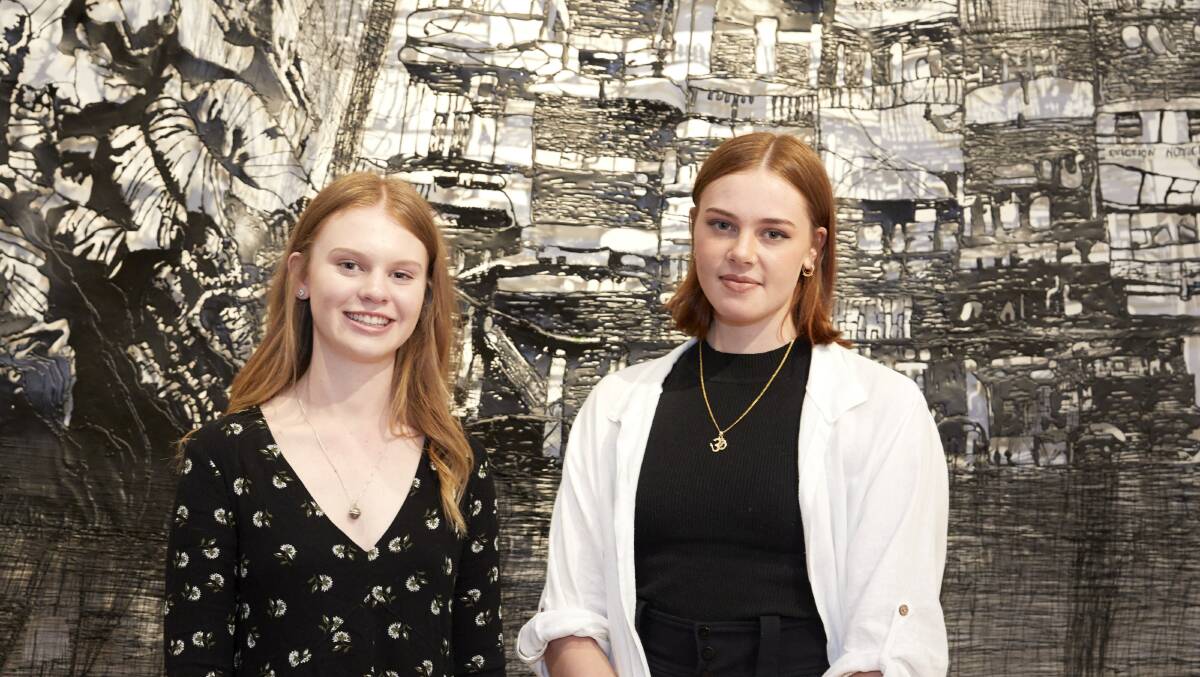 SUPPORT: Lithgow High student Lauren Trounce and Katoomba High student Sama Padmini Cooper at the opening night of ArtExpress. Picture: MIM STIRLING.