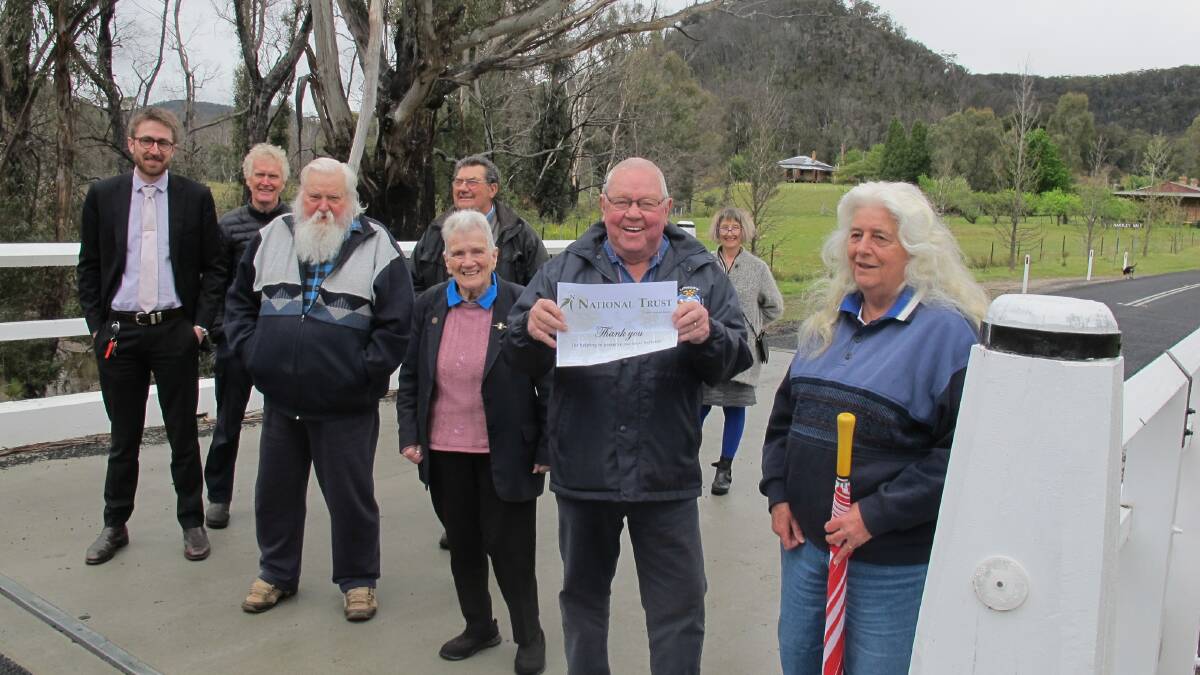 TOGETHER: Standing on the heritage Hartley Vale Bridge are members of the National Trust, Mayor Ray Thompson (holding certificate) and council staff. Picture: SUPPLIED 