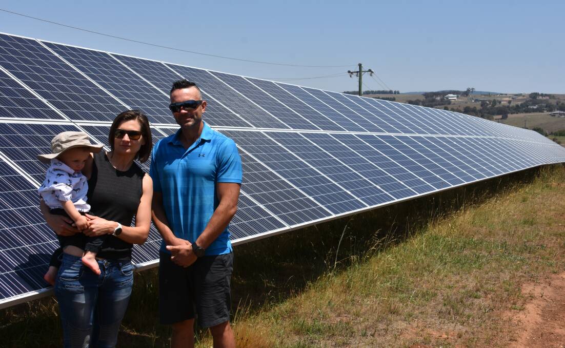 SOLAR: David Millmore with his wife Annika and young son Adrik in front of the solar panels that were the cause of the problem. Picture: CIARA BASTOW 