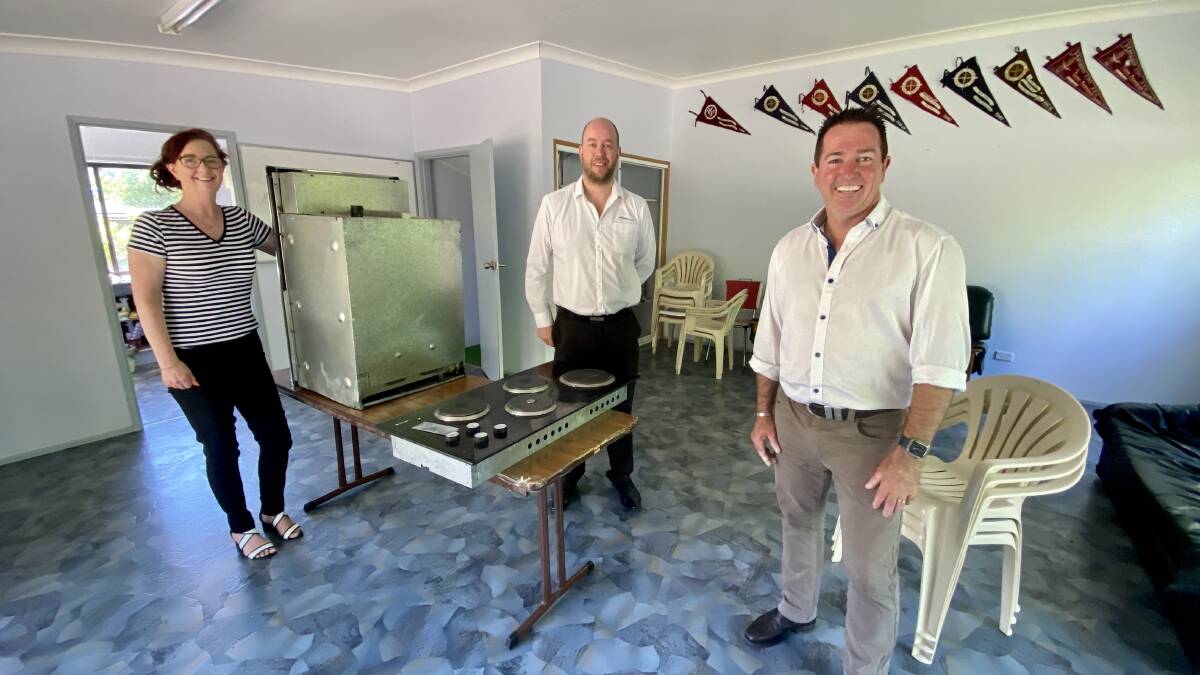 SWIM CLUB: Member for Bathurst Paul Toole, right, with Simone Kerrison and Simon Francis in the clubrooms at Lithgow Swimming Club which are set for a renovation rescue thanks to NSW Government funding. Photo: SUPPLIED