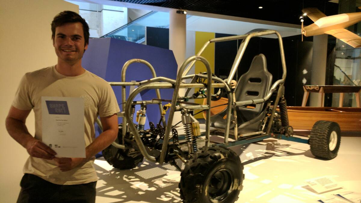 MAD IZAAC: Izaac Van Der Velden stands proudly in front of his Mad Max inspired buggy which is being displayed at the Powerhouse Museum. Picture: SUPPLIED.  
