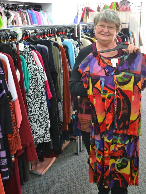 FANCY: Intimate Dreams owner Glenda Anthes holding up a colourful two peice outfit inside her store. Picture: CIARA BASTOW 