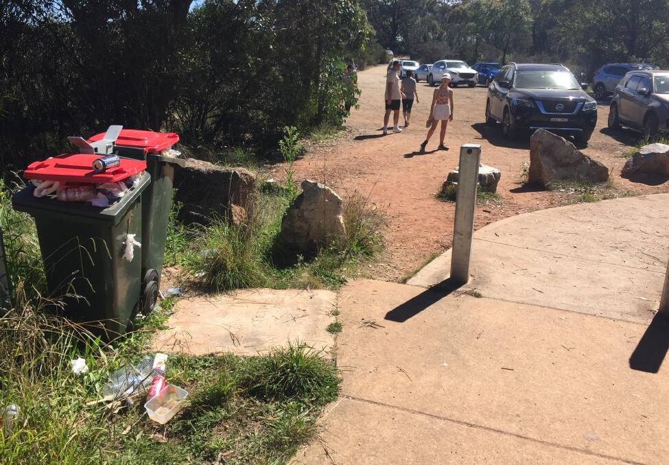 MESS: The two bins situated at Hassans Walls lookout were overflowing by Sunday morning. Photo: JEFF GEDDES 