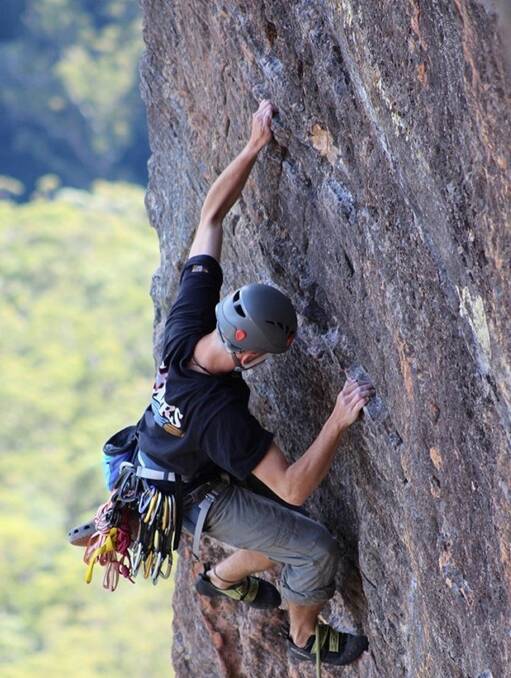 OUTDOORS: Simon Colagiuri braves any fear to climb a steep mountain. 