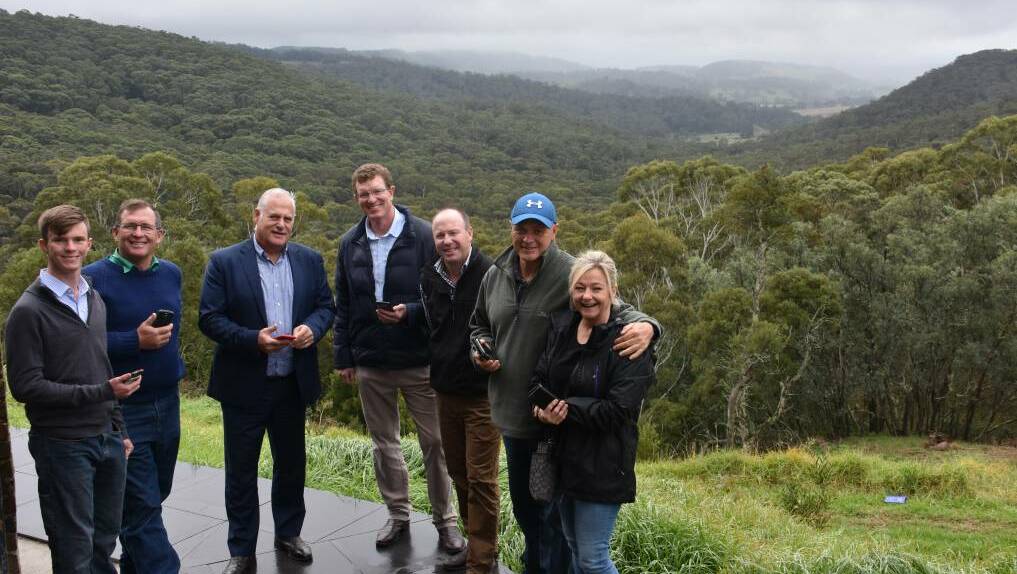 COVERAGE: Kanimbla residents Charlie and John Lowe (left), Jason Green, Sonny and Kerry King (right) with Telstra general manager NSW Michael Marom and Calare MP Andrew Gee (centre). 
