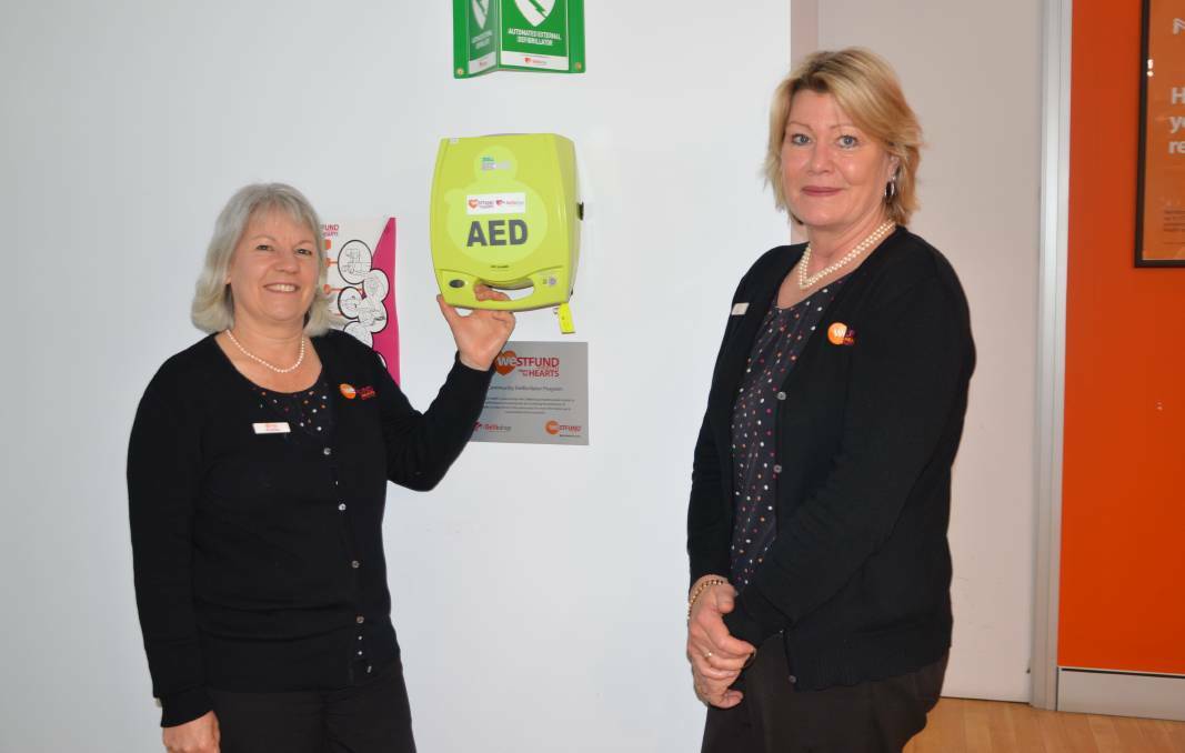  COMMUNITY GRANT: Lithgow Westfund branch consultant Andrea Rapson and team leader Rachel Brooks with the care centre's defibrillator. Photo: ALANNA TOMAZIN.
