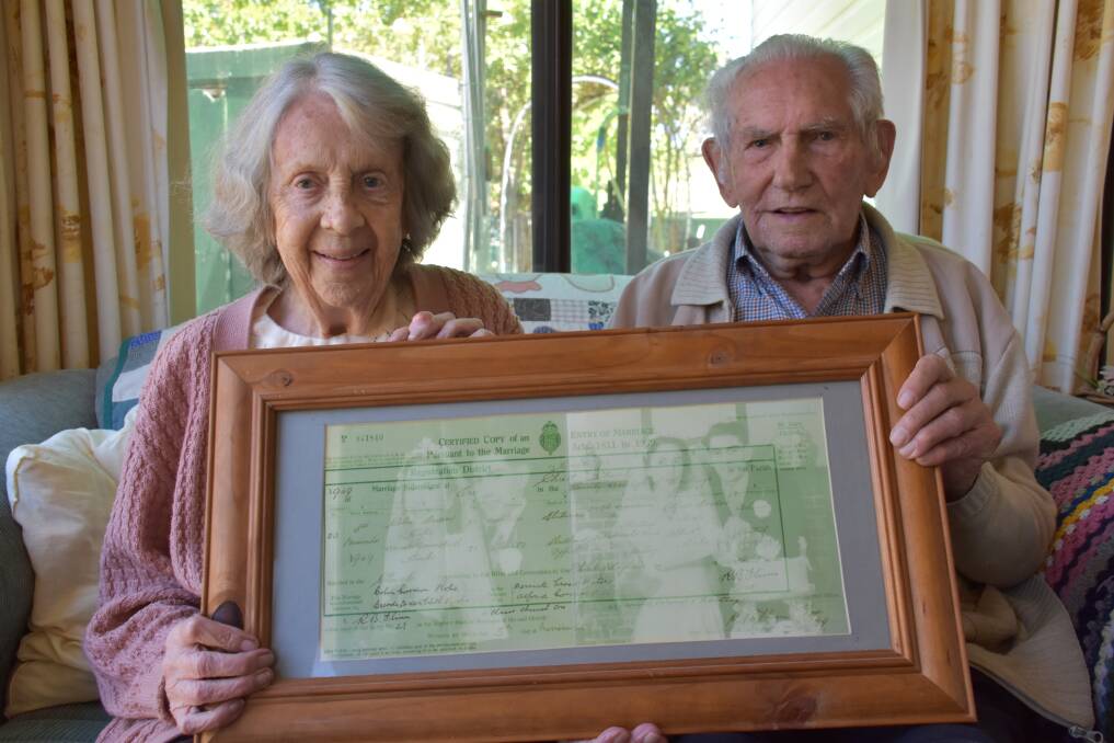 TOGETHER FOREVER: Brenda and Colin Hope hold up their wedding certificate. 