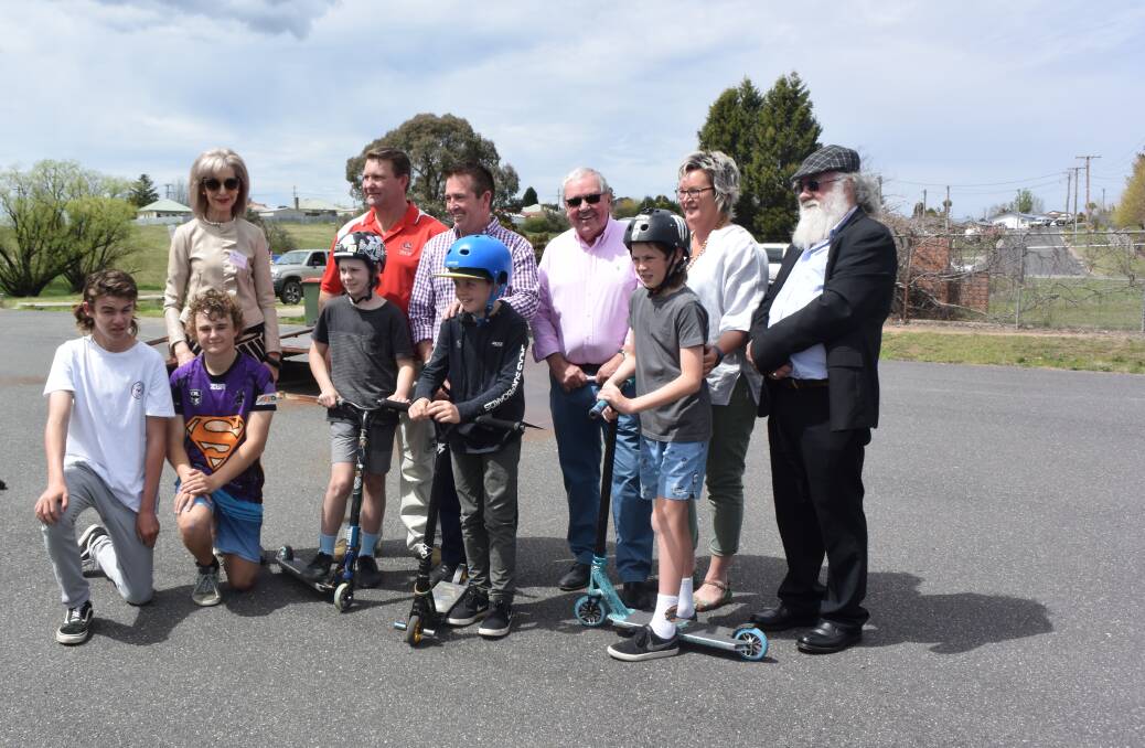 Young boys with the Lithgow City councillors, Lithgow Mayor and Bathurst MP at Wallerawang skate park. 