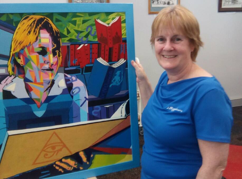 ART: Sharon Lewis from Lithgow Library and Learning Centre with her painting that artist Zavozoa created. Picture: SUPPLIED. 