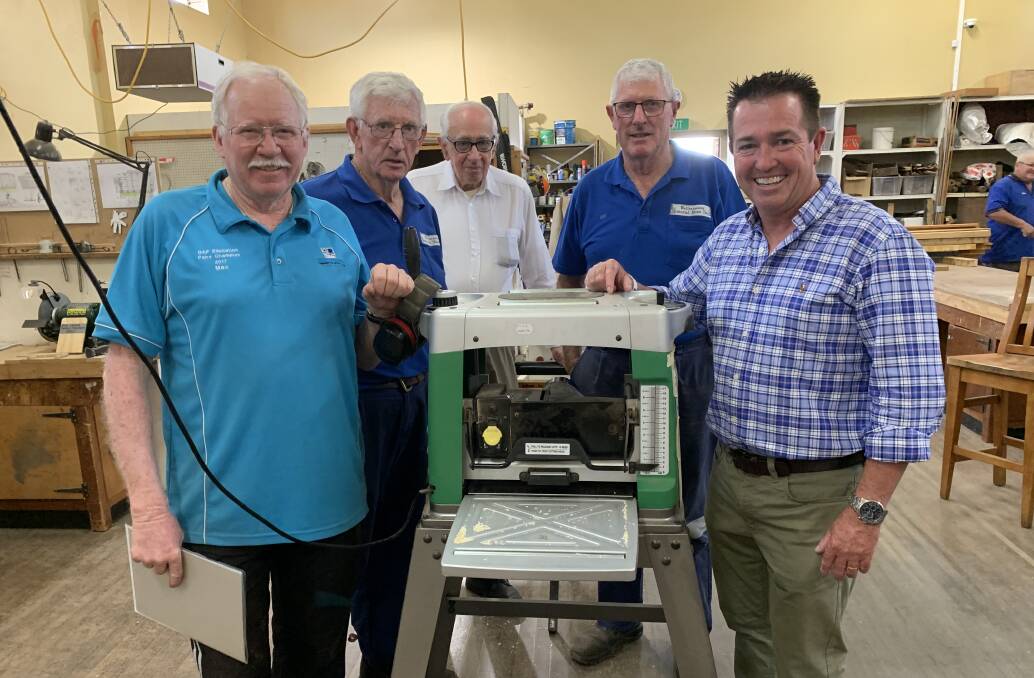 Members of the Wallerawang Mens Shed will use NSW Government funding to buy a bigger planing machine. They are pictured with Bathurst MP Paul Toole, from left: Secretary Ian McMillan, shed manager Mal McDonald, Sam Helmey and President Des Francis. Picture: SUPPLIED 