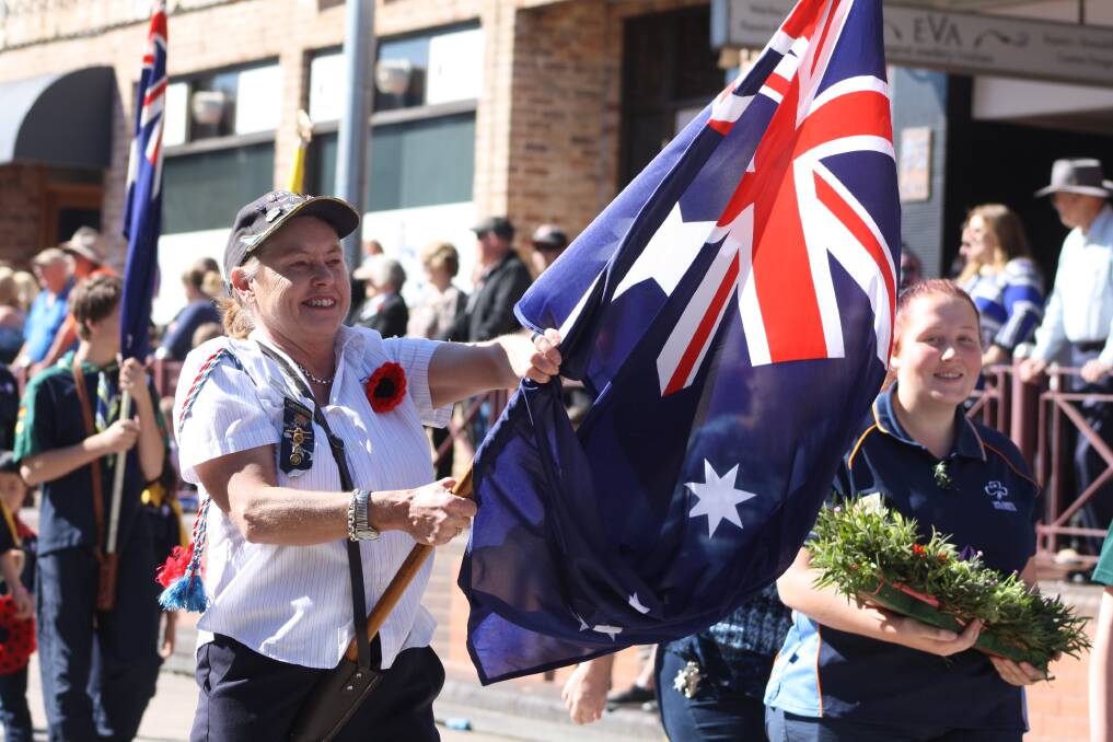 FLYING THE FLAG: Representatives of the Girl Guides took part in the march in 2018. Picture: KIRSTY HORTON. 