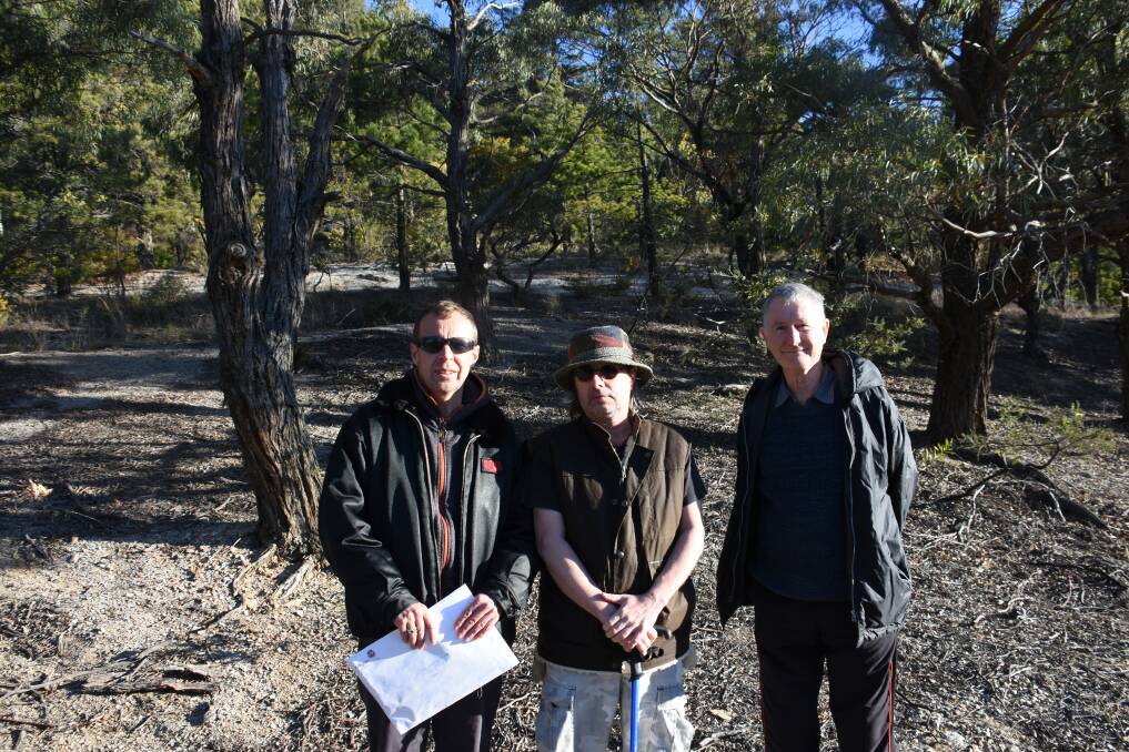RESIDENTS: Wayne Rowe, David Mulligan and Geoff Daley standing in front of the spot on which the double story units are expected to be built. Picture: CIARA BASTOW. 