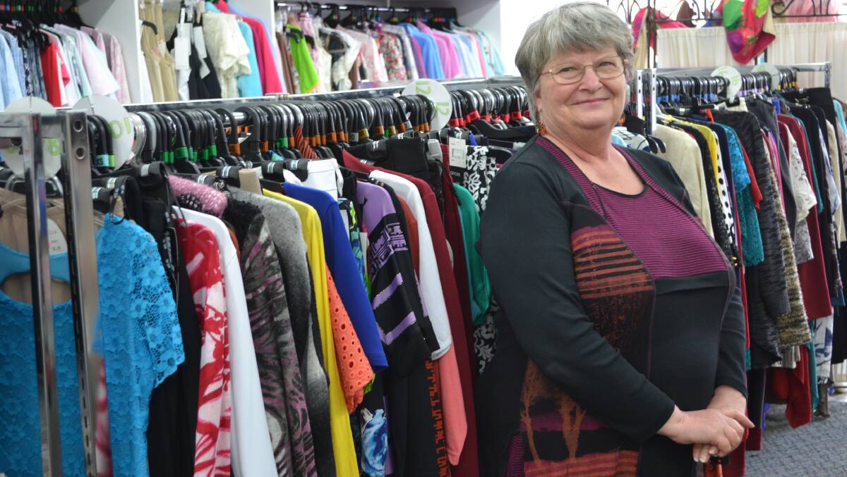 COLOURFUL: Intimate Dreams owner Glenda Anthes standing in front of some of her colourful outfits. Picture: CIARA BASTOW 