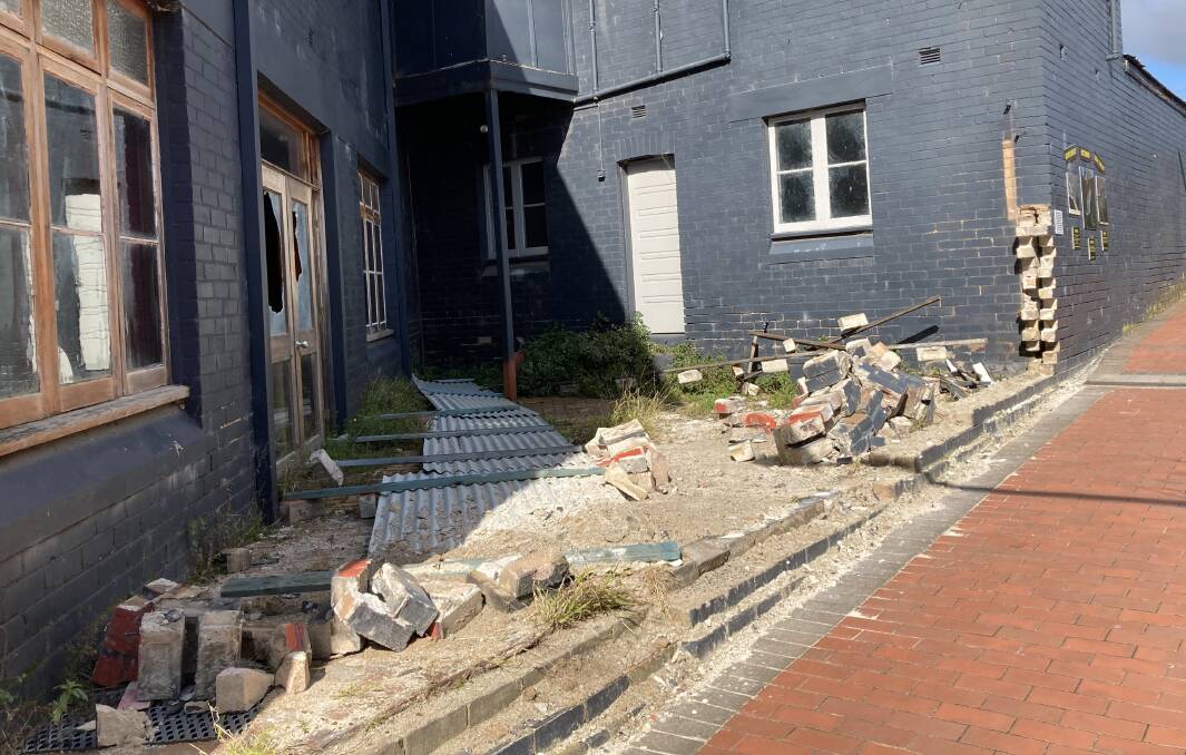 PUZZLED: Lithgow CBD regulars enjoy nothing more than a mystery occurrence. So they're all wondering what caused a gaping hole and pile of rubble in section of the old Tatts Hotel beside the busy walkway to Woolworths. Any takers?