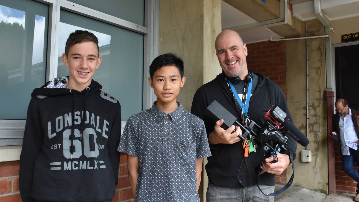 HELPING OUT: Lithgow High School students and 'Book Week' extras Kyle Sheather and Justice Dulay with teacher Sean O'Keefe. 