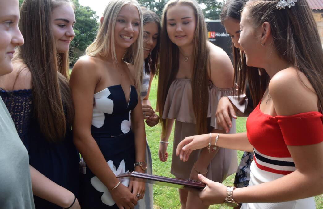HAPPINESS: Under 15s Basketball team sharing a moment after the ceremony.