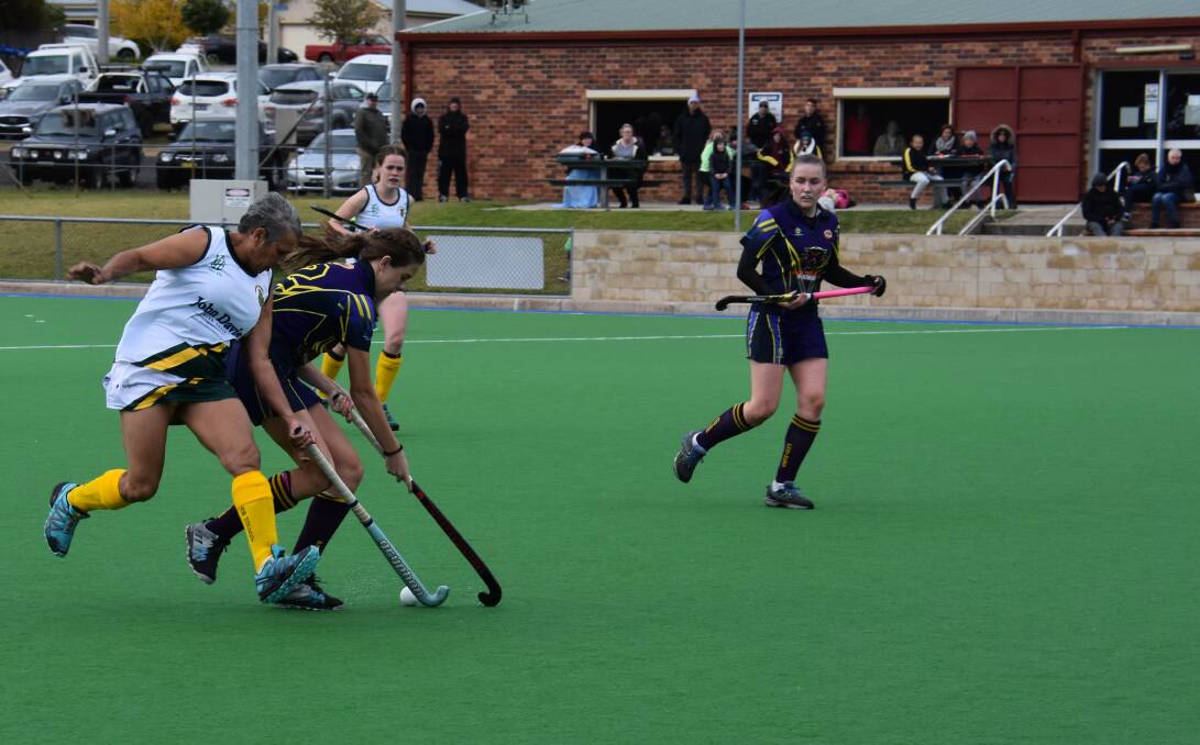 TAKEN OUT: Cyms goal scorer Deborah Orrock tackles Panthers' Chelsea Marshall. Picture: PHOEBE MOLONEY.