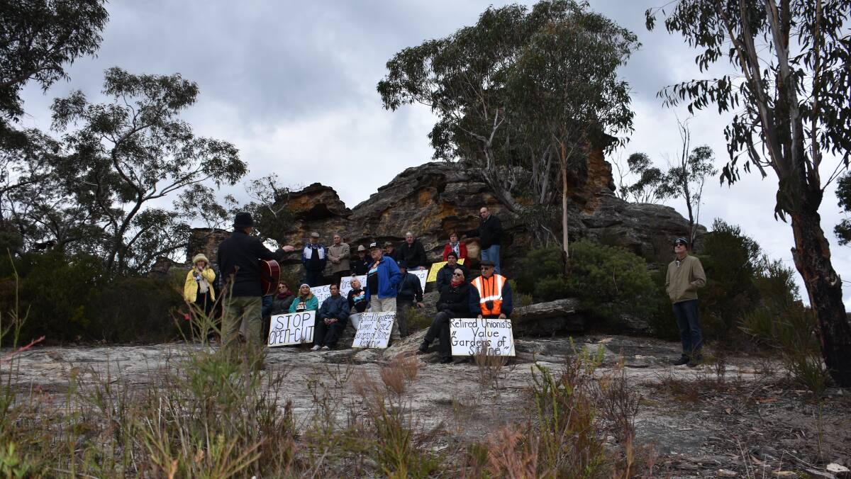 CHANGE: Members of CRUMA with Lithgow Environment Group's Peter Drinkall on a pagoda at Dobbs Drift Lookout. Picture: PHOEBE MOLONEY. 