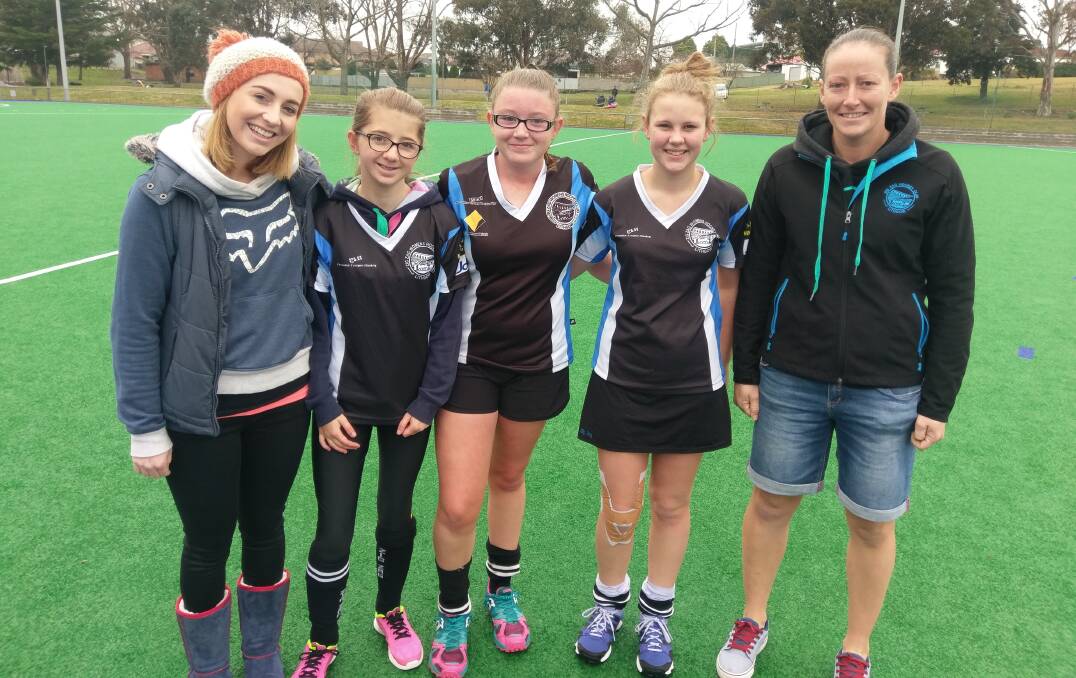 SUPPORTING THEIR JUNIORS: Zig Zag team member Dannii Lemcke, with junior players Chloe, Lucy and Olivia and Premier League coach Jana Winnard. Picture: SUPPLIED. 