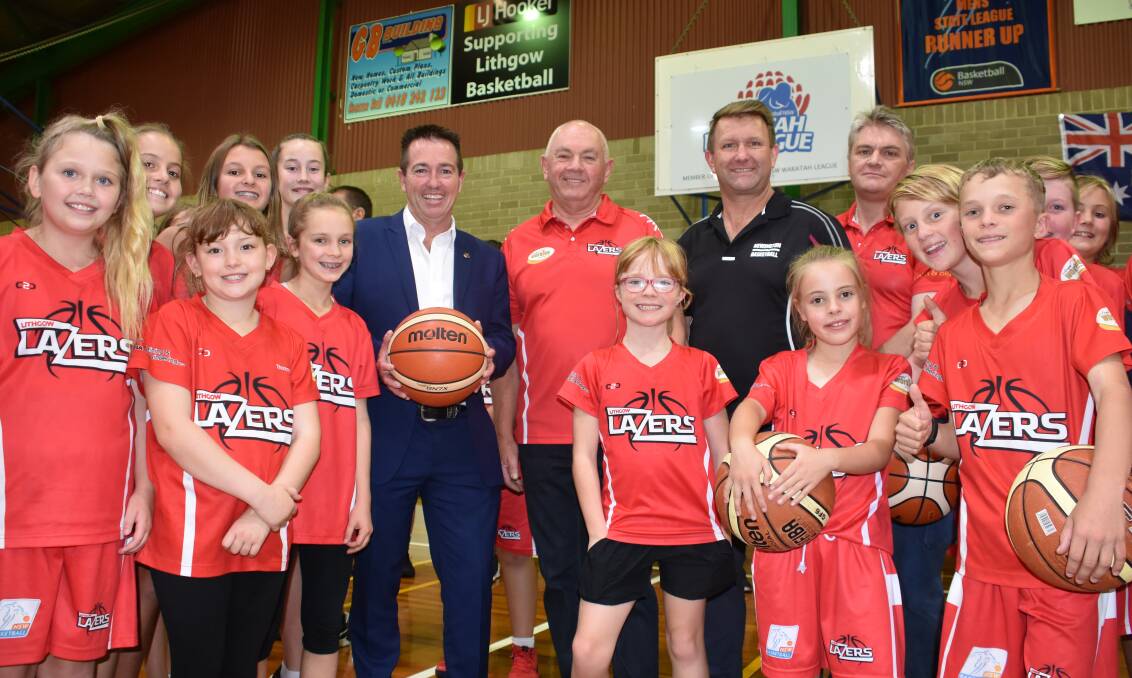 SLAM DUNK: Lithgow Lazers juniour players with Richard Marjoram, MP Paul Toole and Councillor Darryl Goodwin at Lithgow Basketball Stadium. Picture: PHOEBE MOLONEY. 