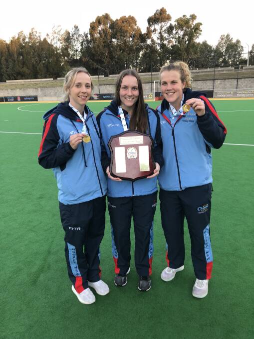 GOLD MEDALS: NSW captain Abigail Wilson, Clare Bosman and Andrea Gillard with the Australian U21 field hockey trophy. Picture: SUPPLIED