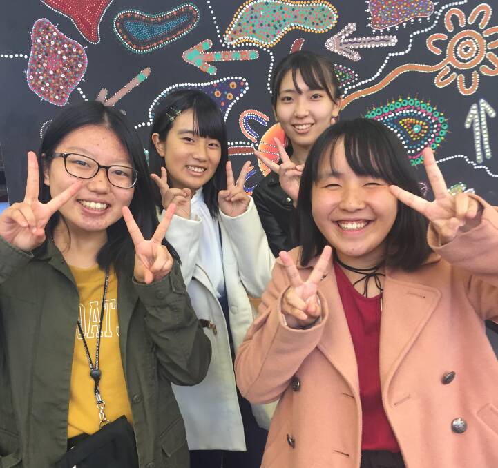 CHEESE: Honoka Okajima, Manae Okabayashi, Runa Ito and Kurumi Hosoda in La Salle Academy's library. Picture: PHOEBE MOLONEY