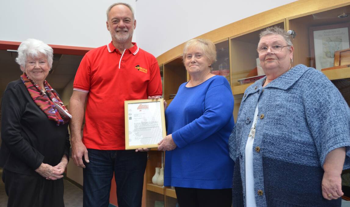 SURPRISE: Lithgow Hospital Auxiliary treasurer Margaret Clunne, president Jean Hill, secretary Elaine Robison and president of the Land Rover Club ACT Andrew Lockley. Picture: PHOEBE MOLONEY. 