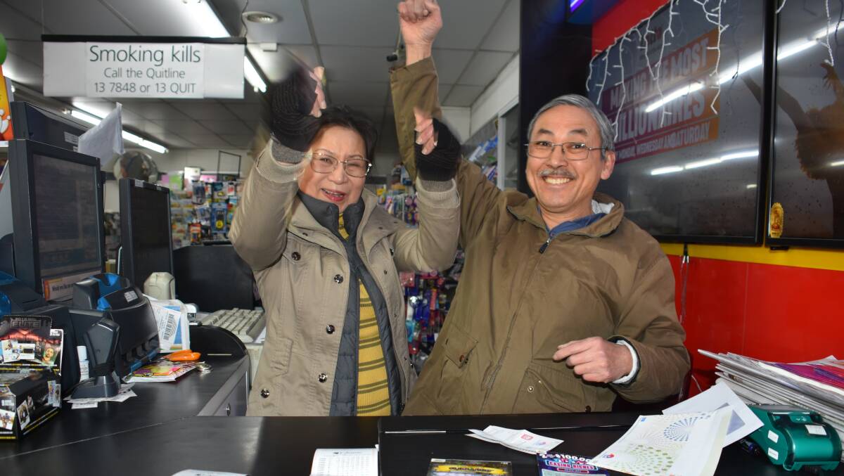 GOLDEN TICKET: Helen and Jimmy Nguyen, the shopkeepers at Top End Newsagency where the winning ticket was sold. Picture: PHOEBE MOLONEY. 