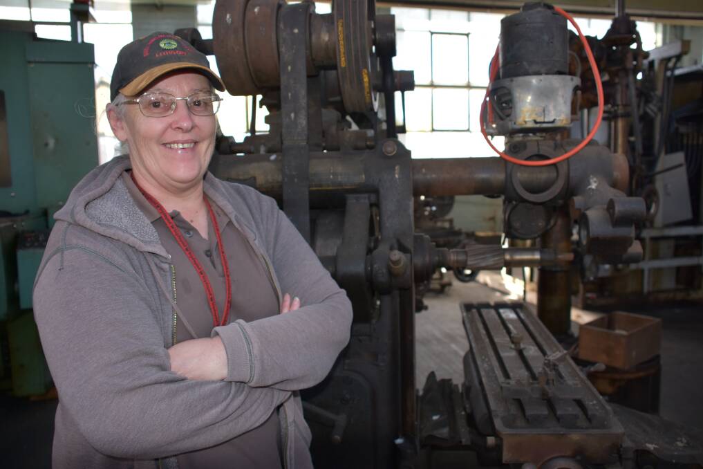 MACHINE: Museum volunteer Deb Smith with pieces from the museum's machinery collection dating back to 1912. Picture: PHOEBE MOLONEY. 