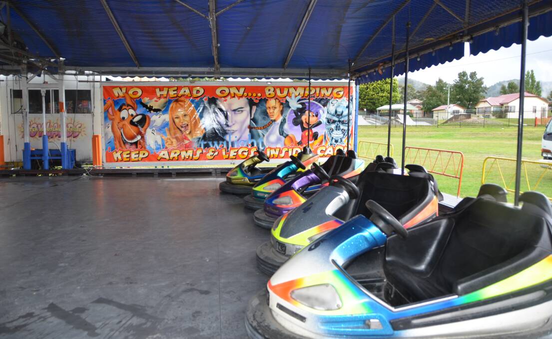 HARD TO DODGE: The Dodgem Cars have been set up in preparation for the Lithgow Show opening at 2pm on Friday, March 17. An overcast lead-up to the festival saw the people working through rain. Picture: HOSEA LUY