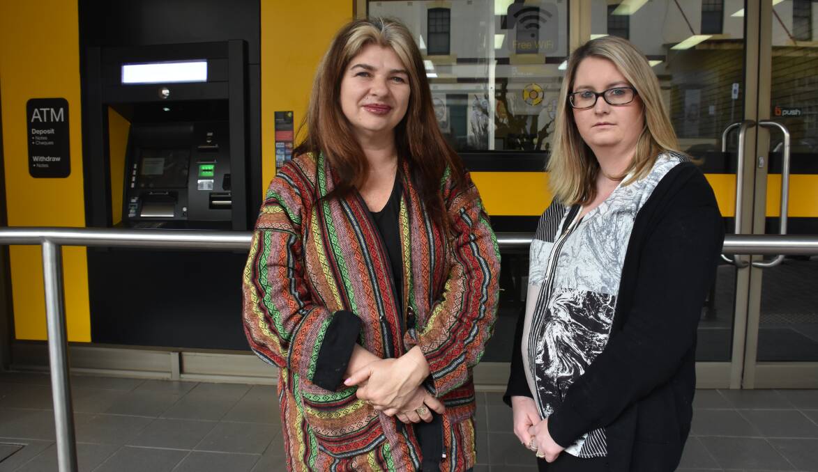 FEELING BETRAYED: Shelley Bowen and Ashley Howden outside the Portland branch of the Commonwealth Bank. Picture: PHOEBE MOLONEY
