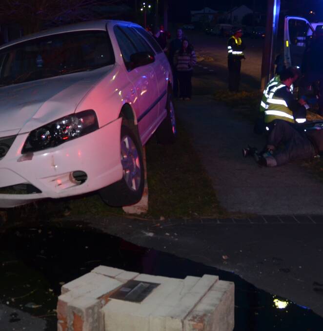 COLLISION: The vehicle mounted a brick fence of a house on Cook Street. Picture: PHOEBE MOLONEY. 