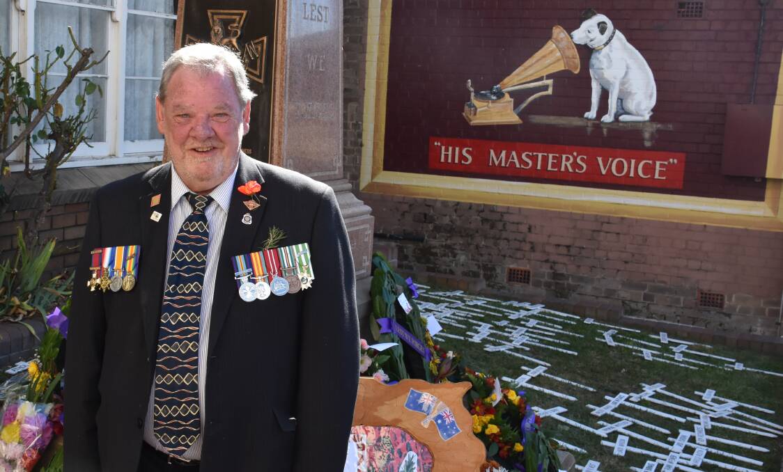 PROUD: Ian Burrett wearing his own medals from Vietnam and his father's. Picture: PHOEBE  MOLONEY. 