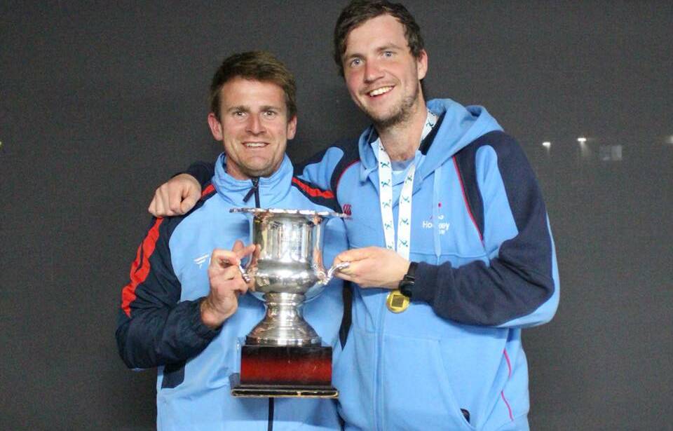 DEFENCE UNIT: Zig Zag's Ben Kelly with David Reid holding the Australian Country Men's Championship cup after NSW's win last weekend. Picture: BARRY REID. 