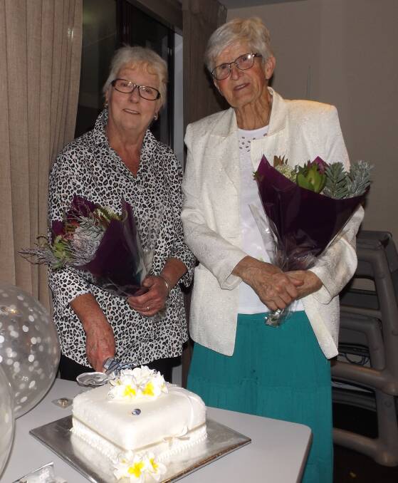 BIRTHDAY GIRLS: Margaret Buckley and Margaret Hickie, who both celebrate birthdays in March, cut the Quota cake. Picture: SUPPLIED. 