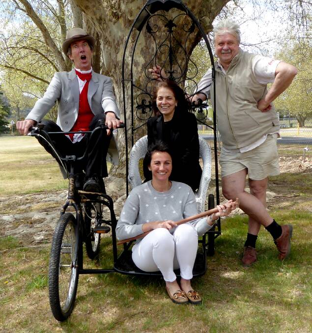 TRAVELLING MEDICINE SHOW: Martin van der Meyden and Ian Rufus with members of Lithgow Living History bicycle made by Stephen Cunningham. Picture: SUPPLIED. 