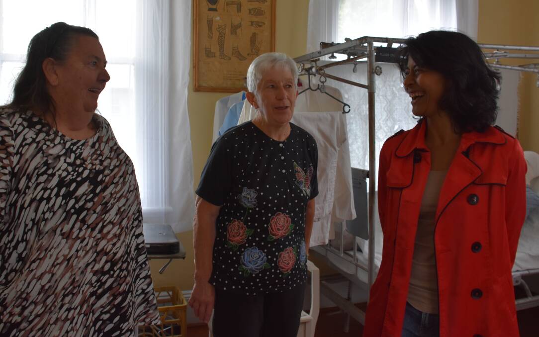 ON WARD: Sisters Anne Lennon and Fay Fulton with museum manager Premala Sangarananda in a room that recreates Portland's old hospital. Picture: PHOEBE MOLONEY