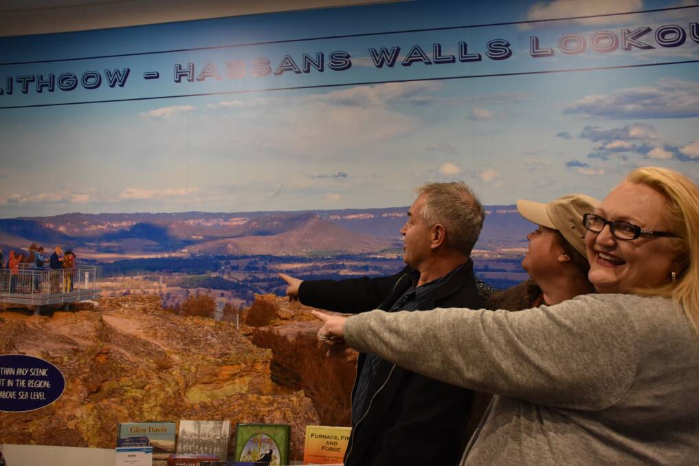 DREAM DESTINATION: Robert Swinton, Anna Carter and Michelle Norrie checking out the new Hassans Walls signage inside the centre. Picture: PHOEBE MOLONEY