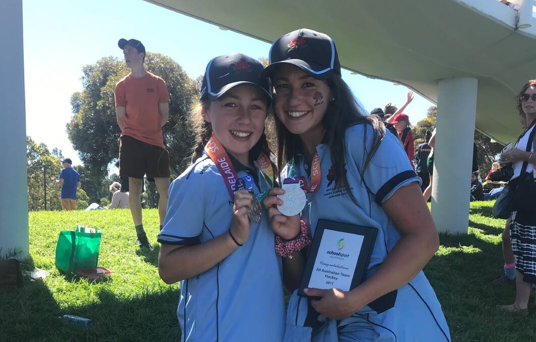 TRUE BLUE: Striker and midfielder Hannah Kable with little sister Lily at the Pacific School Games in 2017, where they both represented NSW teams in hockey. Picture: SUPPLIED. 