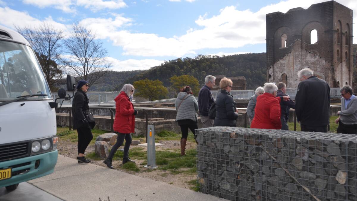 BUS LOAD: Tidy Towns members visit the Blast Furnace with Mr MacDonald. 