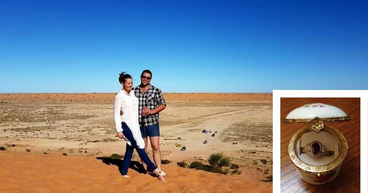 BIG RED: Elizabeth and Jason Docherty of Kandos at the top of the sand dune in the Simpson Desert where Elizabeth lost her wedding ring in June. Picture: SUPPLIED. 
