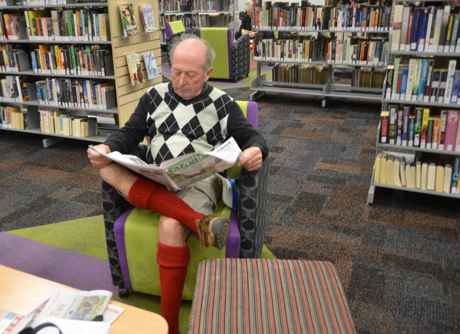 Library member Clive Laing enjoys the Lithgow Library's new furnishings. 
